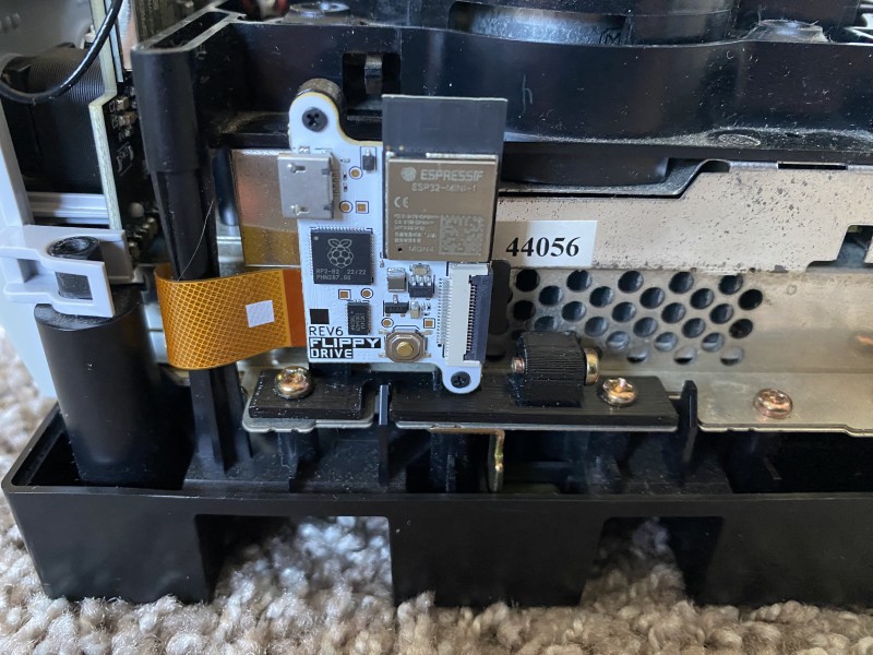 A picture of the Flippydrive inside an exposed GameCube